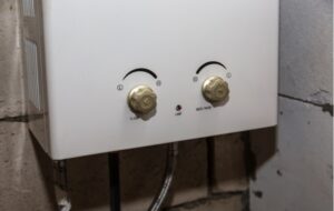 A close up of a tankless hot water heater, ideal for an area with less space