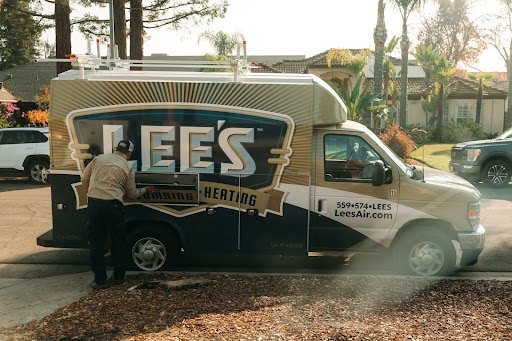 Lee's plumber getting into work truck