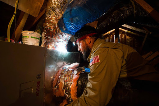 Lee's technician working on ventilation.
