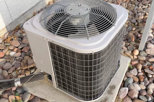 A central AC unit installed outside a home.